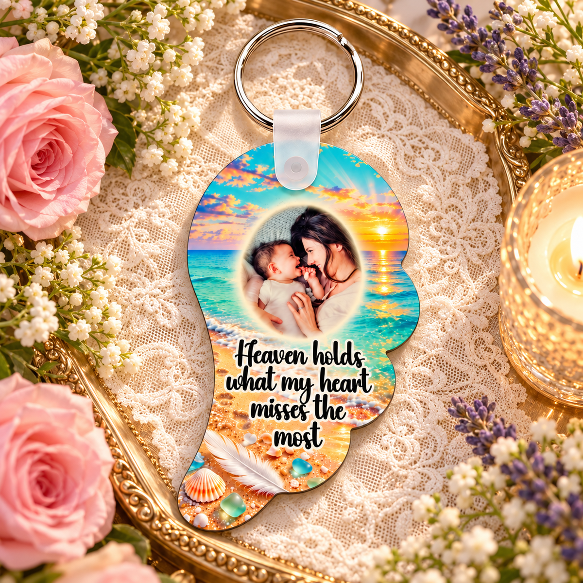 Seaside memorial angel wing photo keyring on a gold tray with flowers, lace and candlelight