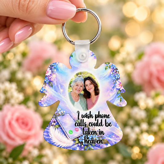 Personalised memorial photo angel keyring held in hand featuring I wish phone calls could be taken in heaven verse