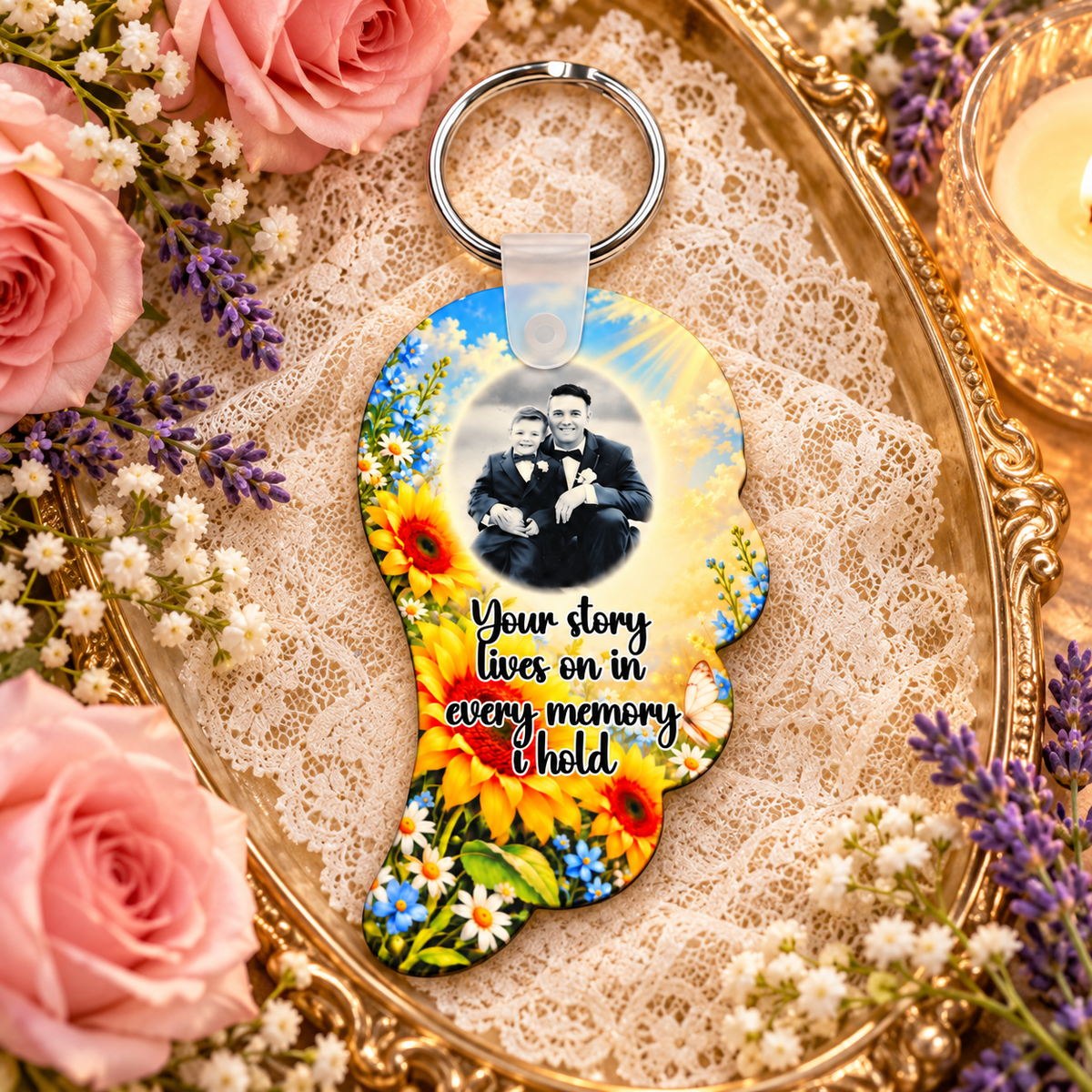 Sunflower memorial photo angel wing keyring displayed on a gold tray with lace, pink roses, lavender and candlelight
